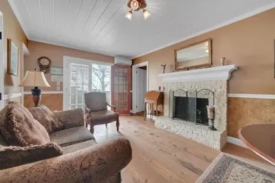 a living room with a couch and a fireplace at Romantic Victorian Getaway The Hideaway in Sutter Creek