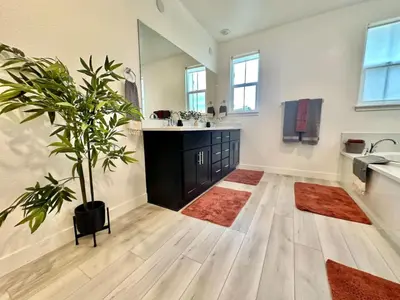 a bathroom with a sink and a potted plant at Charming and Modern 3-Bedroom Home in Rocklin in Rocklin