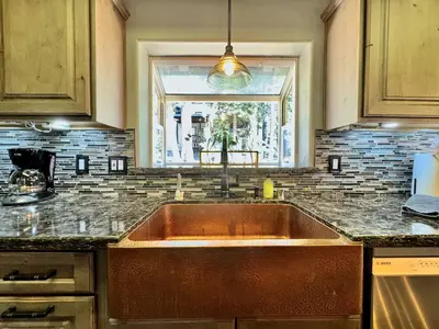 a kitchen with a large sink and a window at Cozy Tahoe Retreat Huge Yard in South Lake Tahoe