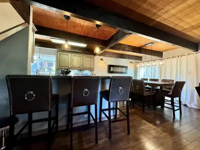a kitchen and dining room with a table and chairs at Cozy Tahoe Retreat Huge Yard in South Lake Tahoe