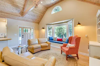 a living room with a couch and a window at Auburn Farmhouse with Fireplace, Close to Wineries in Auburn