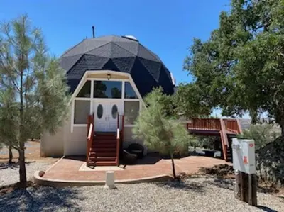 a small house with a dome on top of it at Lakeview Dome in La Grange