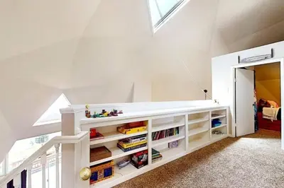 a childs room with a white book shelf at Lakeview Dome in La Grange