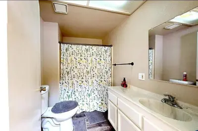 a bathroom with a shower and a toilet and a sink at Lakeview Dome in La Grange