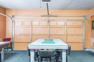 a garage with a table and chairs in a room at Beautiful Sunsets at 3BR Villa in Reno in Reno