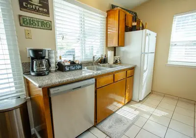a kitchen with a sink and a white refrigerator at Beautiful Condo by Park Entrance in Three Rivers