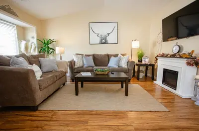 a living room with a couch and a fireplace at Cozy Condo minutes from the Sequoia National Park in Three Rivers
