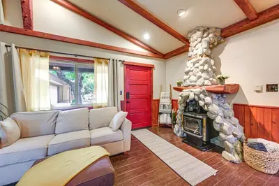 a living room with a couch and a fireplace at Idyllic Home in Kernville with Private Beach Access in Kernville
