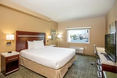a hotel room with a large bed and a window at Gold Dust West in Carson City