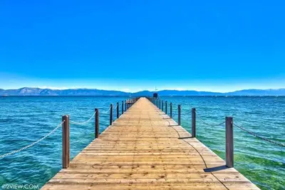 a wooden pier in the middle of the water at TML 04 - Beautiful 1 BR Condo in Tahoe City in Tahoe City