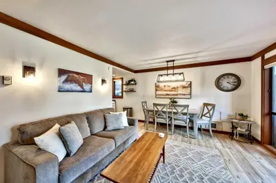 a living room with a couch and a table at TML 04 - Beautiful 1 BR Condo in Tahoe City in Tahoe City