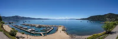 a group of boats parked in a harbor on a lake at Newley remodeled, two story, two-bedroom condo nothing but Views of Lake Tahoe! in Incline Village