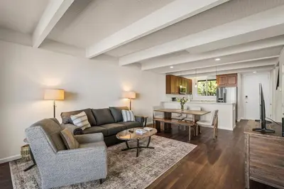 a living room with a couch and a table at Newley remodeled, two story, two-bedroom condo nothing but Views of Lake Tahoe! in Incline Village