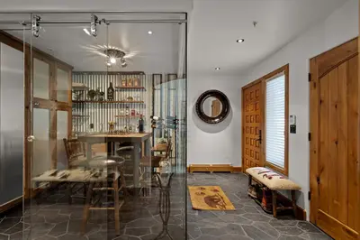 a room with a table and chairs and a glass door at Third Creek- Experience the Ultimate in Luxury in Incline Village