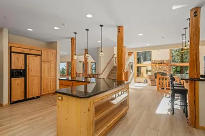 a kitchen with wooden cabinets and a counter top at Do not miss your chance to vacation at this five bedroom 5 bath mountain home in Incline Village