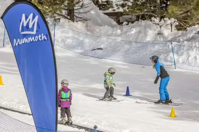 a group of people on skis in the snow at Crestview 48 in Mammoth Lakes