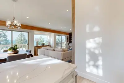 a kitchen and living room with a couch and a table at Towering Pine in Incline in Incline Village