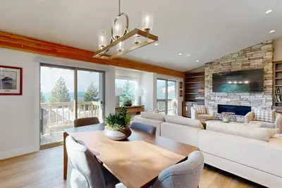 a living room with a table and a couch at Towering Pine in Incline in Incline Village