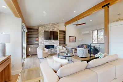a living room with a couch and a table at Towering Pine in Incline in Incline Village