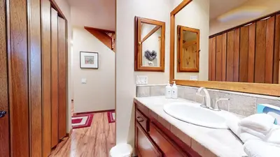 a bathroom with a sink and a mirror at Snowcreek I #47 condo in Mammoth Lakes