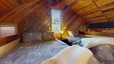 a room with two beds in a attic at Snowcreek I #47 condo in Mammoth Lakes