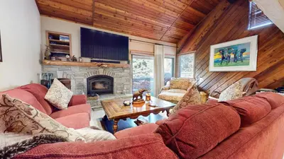 a living room with a couch and a fireplace at Snowcreek I #47 condo in Mammoth Lakes