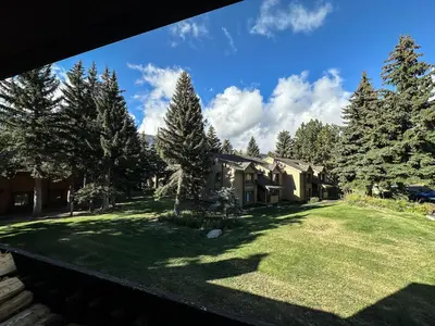 a view of a house from the yard at Snowcreek I #47 condo in Mammoth Lakes