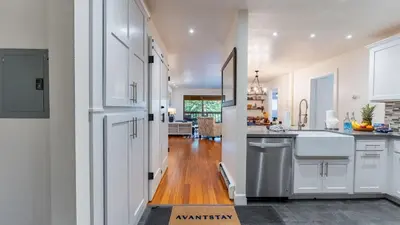 a kitchen with white cabinets and a white sink at Walk to Lake DiningShops 5mins to Ski Resort Incline Paradise by AvantStay in Incline Village