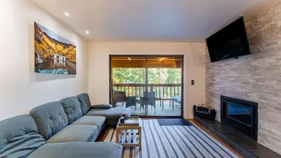 a living room with a couch and a fireplace at Walk to Lake DiningShops 5mins to Ski Resort Incline Paradise by AvantStay in Incline Village