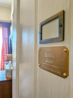 a sign on the door of a room at The JD Hyde Historic Inn in Visalia