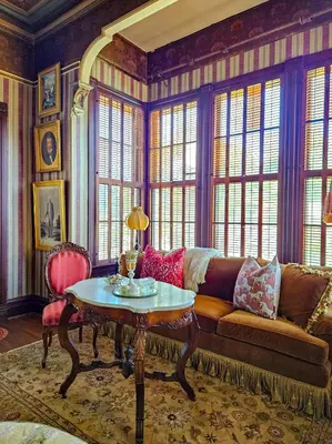 a living room with a couch and a table at The JD Hyde Historic Inn in Visalia