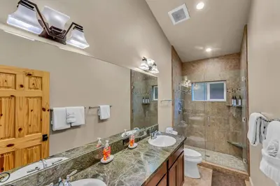 a bathroom with two sinks and a shower at Kings Beach Retreat, Hot Tub, Walk to Beach in Kings Beach