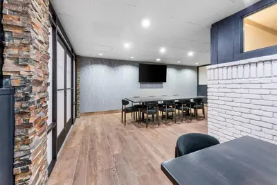 a conference room with a table and chairs at The Federal Hotel Downtown Carson City, an Ascend Collection Hotel in Carson City