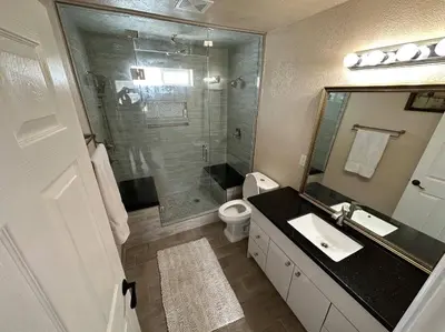 a bathroom with a shower and a sink and a toilet at Private Old Southwest Casitas in Reno