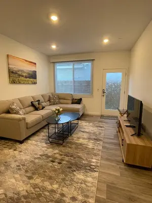 a living room with a couch and a table at Cozy-Quiet-Spacious Guest Suite in Fresno Clovis California in Fresno