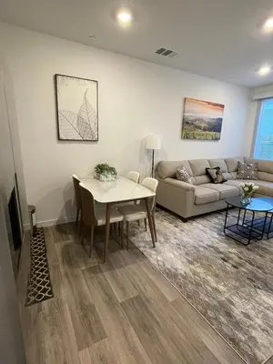 a living room with a couch and a table at Cozy-Quiet-Spacious Guest Suite in Fresno Clovis California in Fresno