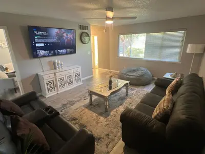 a living room with a couch and a coffee table at Beautiful Home & Pool in Fresno