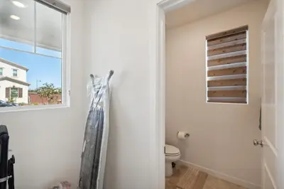 a bathroom with a toilet and a window at Spacious 3BR Home with Charming Backyard home in Folsom
