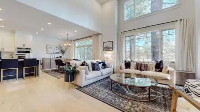 a living room with two couches and a table at Timbers #12 townhouse in Mammoth Lakes