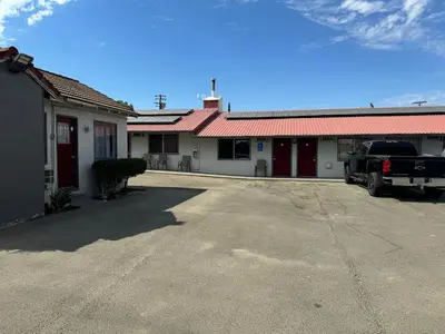 a truck parked in front of a building at Coalinga Motel in Coalinga