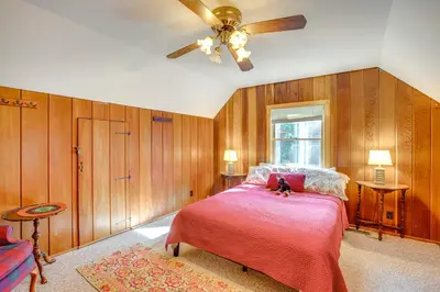 a bedroom with a bed and a ceiling fan at 1 Mi to Lake Tahoe Rustic Cabin with Boat Dock in Tahoma