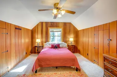 a bedroom with a bed and a ceiling fan at 1 Mi to Lake Tahoe Rustic Cabin with Boat Dock in Tahoma