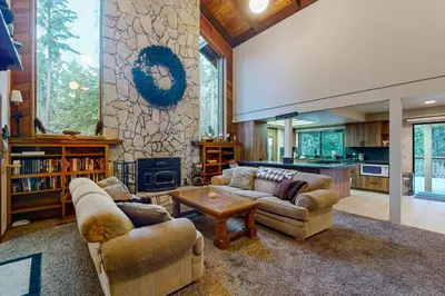 a living room with two couches and a fireplace at Tranquil Pines Retreat in Shaver Lake