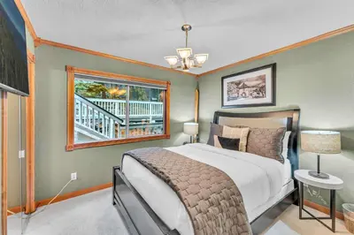 a bedroom with a bed and a window at Modern Tahoe Retreat with Grill Walk to Beach in Homewood