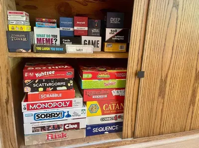 a book shelf filled with lots of books at The Sugar Pine Speakeasy in Homewood