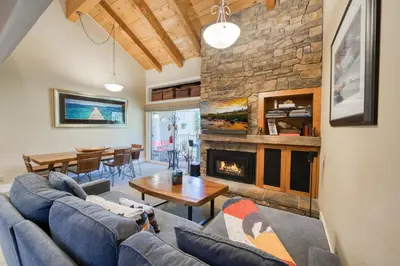 a living room with a couch and a fireplace at Carnelian Woods # 57 - 3 BR 2 BA Pet Friendly With HOA Amenities in Carnelian Bay