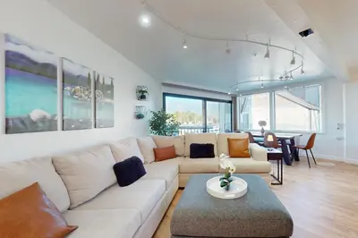 a living room with a white couch and a table at Keys to Paradise in South Lake Tahoe