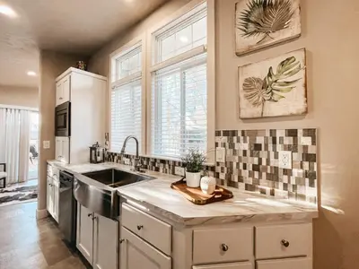 a kitchen with a sink and a counter top at Beautiful Private Cottage Sunstone in Reno