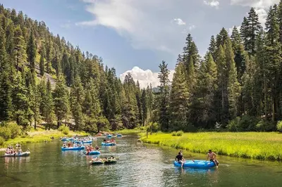 a group of people rafting down a river at Cozy Palisades Tahoe Ski Cabin 3BR 3BA Free Shuttle to Lifts Book on Mobile for Promo Price in Alpine Meadows