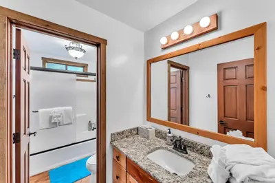 a bathroom with a sink and a mirror at Northstar Retreat with Hot Tub & FREE Shuttle Access in Truckee
